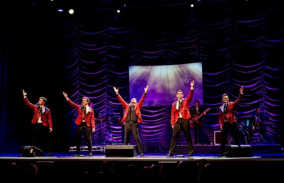 Peter is joined on stage by performers from West End musicals.