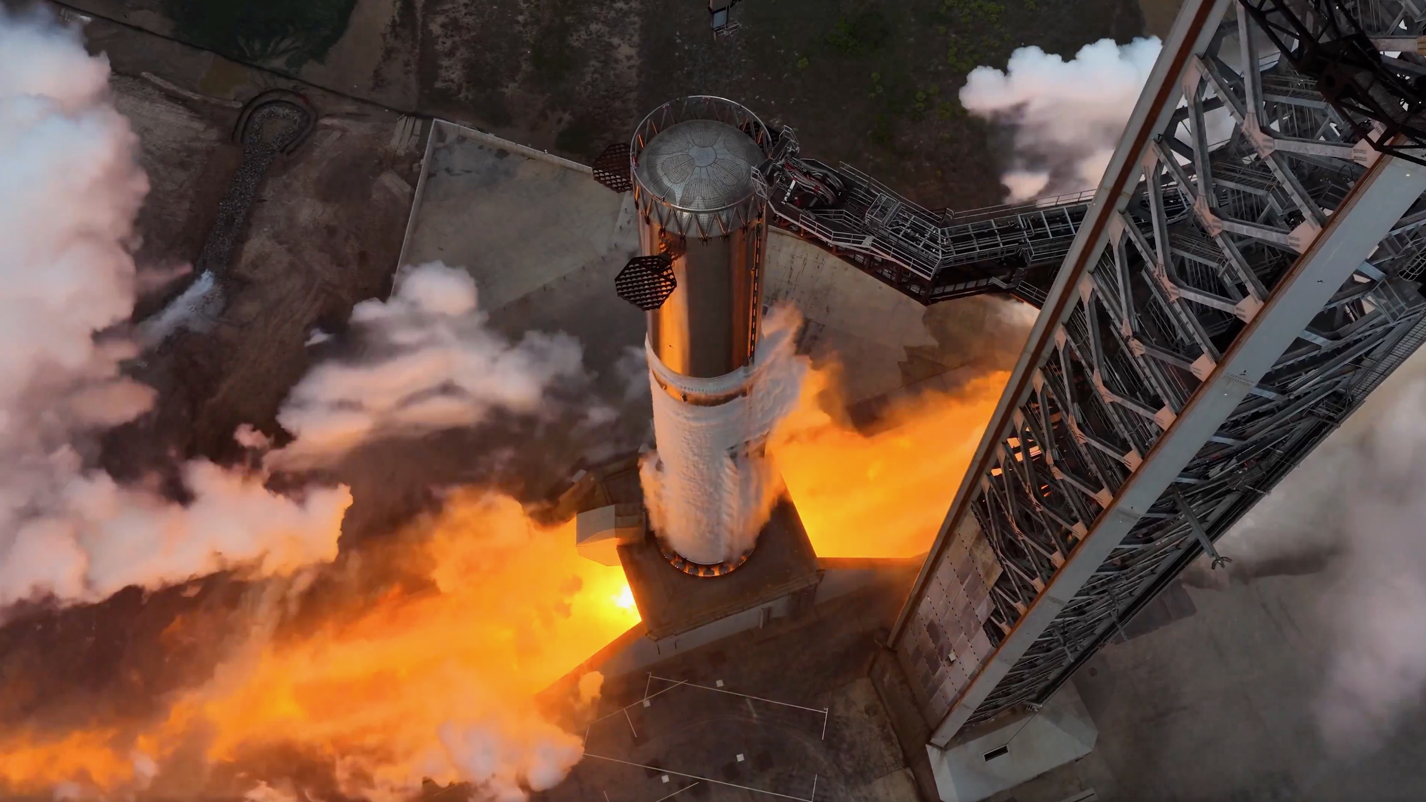 A rocket firing engines on the pad during a test
