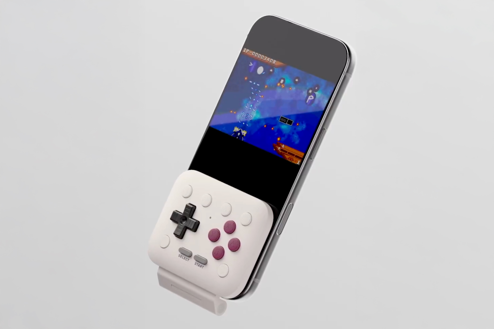 Contrôleur 8BitDo FlipPad connecté à un smartphone.